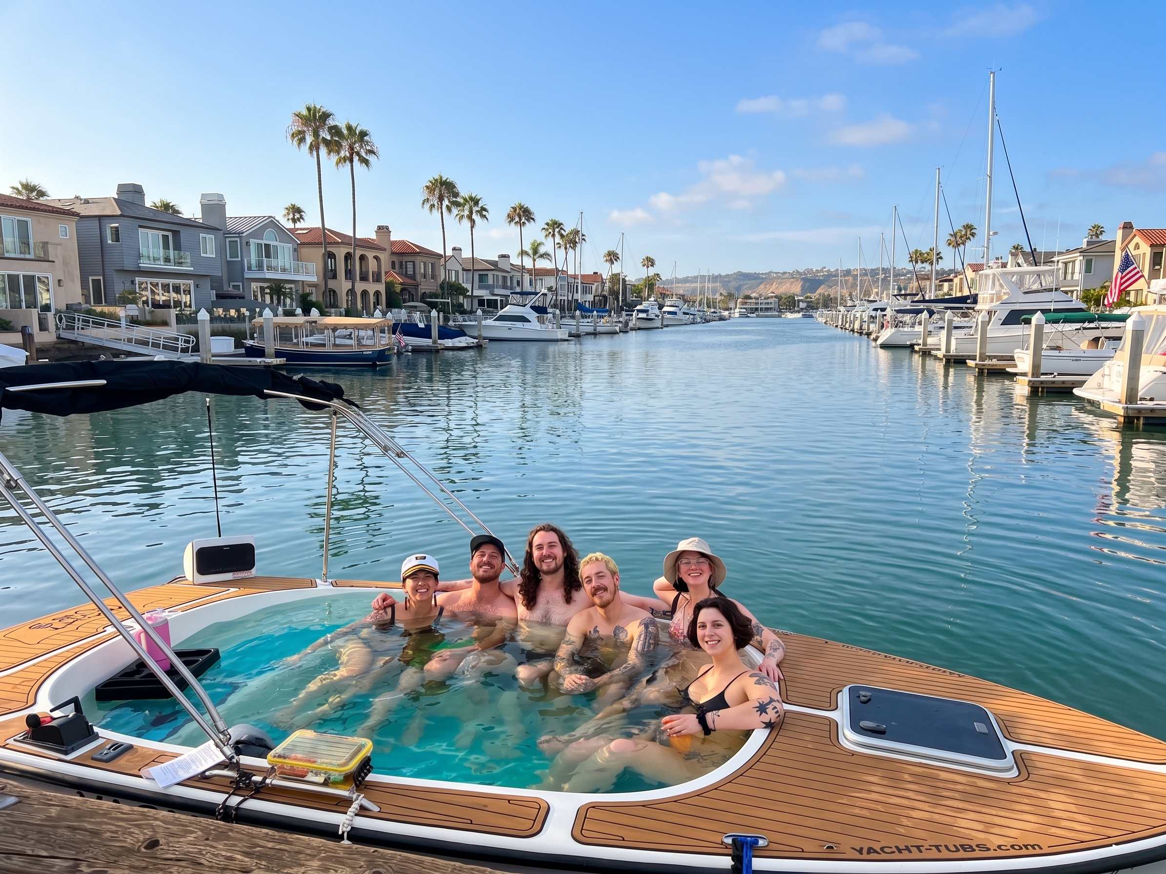 Six guests smiling together on a real daytime hot tub boat cruise in Newport Harbor